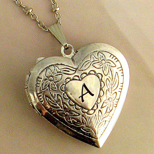 Write Alphabet on Gold Heart Locket Jewelry